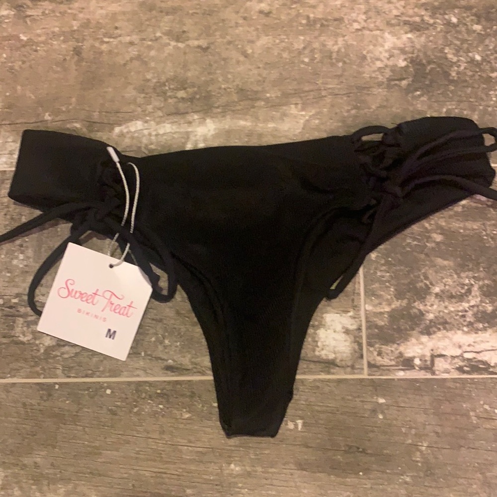 Skimpy black bikini bottom